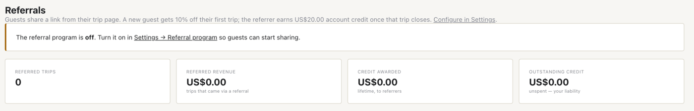 The Referrals page on a fresh install: the program is still off and every counter is at zero. Once enabled, these tiles track referred trips, referred revenue, credit awarded and the outstanding credit you still owe referrers.